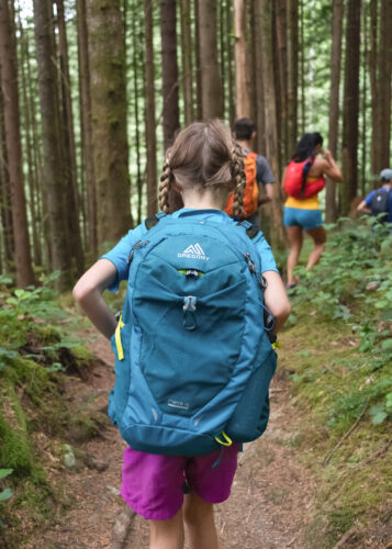 children hiking with backpacks